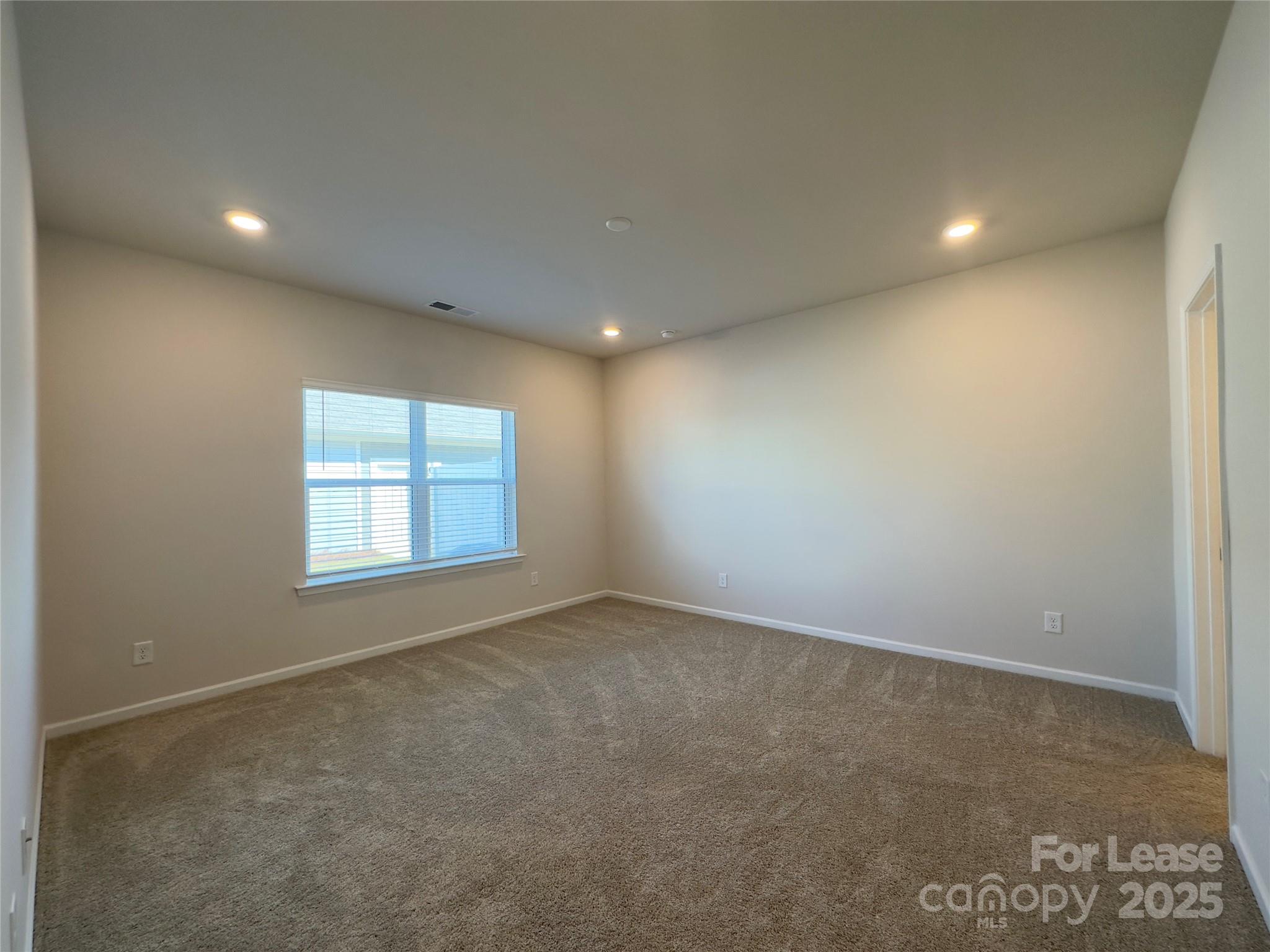 403 Wescott Street, Unit 68 Indian Trail, NC 28079 - Photo 12 of 42 an empty room with windows