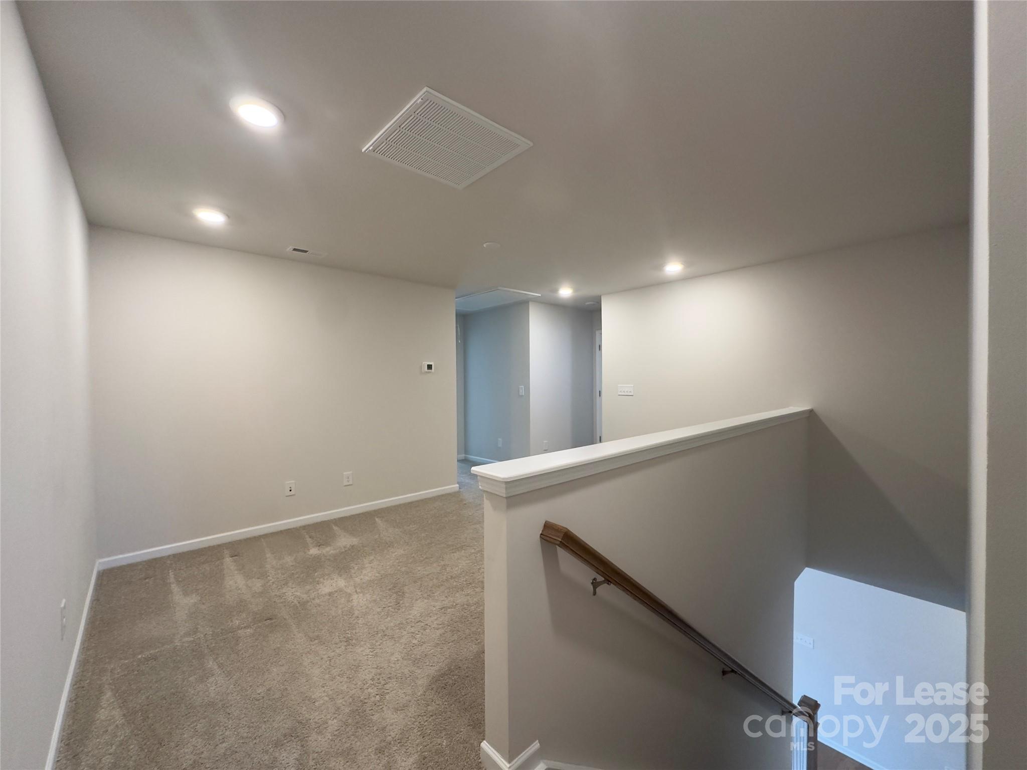 403 Wescott Street, Unit 68 Indian Trail, NC 28079 - Photo 18 of 42 an empty room with wooden floor