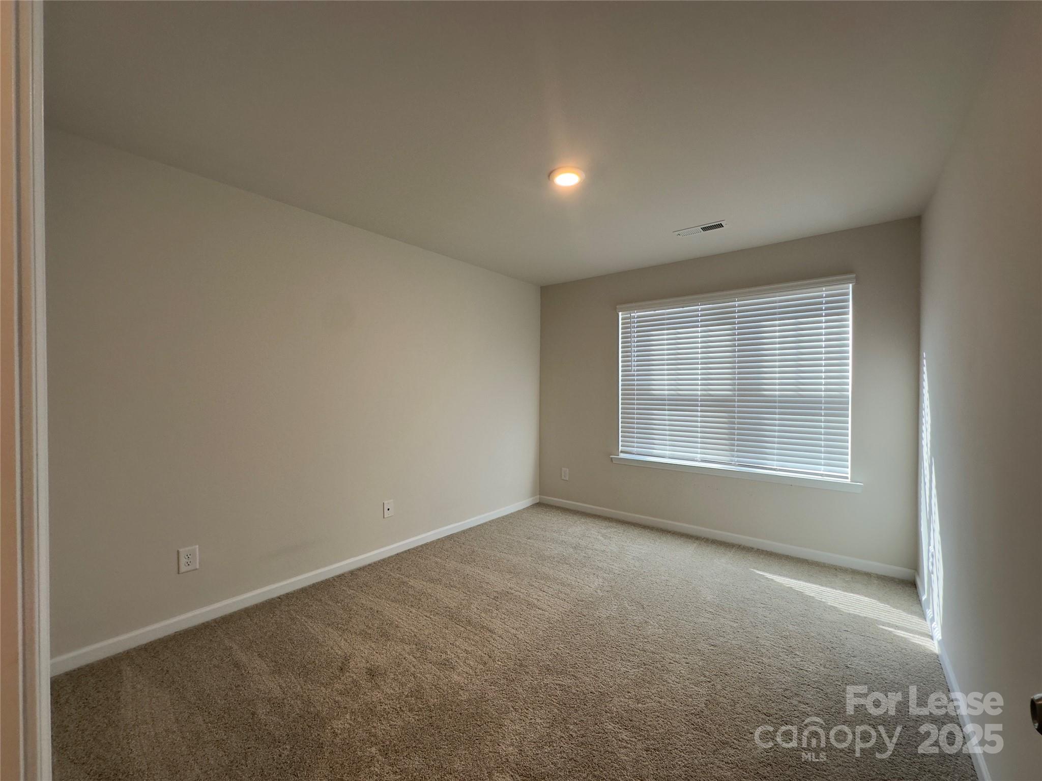403 Wescott Street, Unit 68 Indian Trail, NC 28079 - Photo 21 of 42 an empty room with a empty space and windows