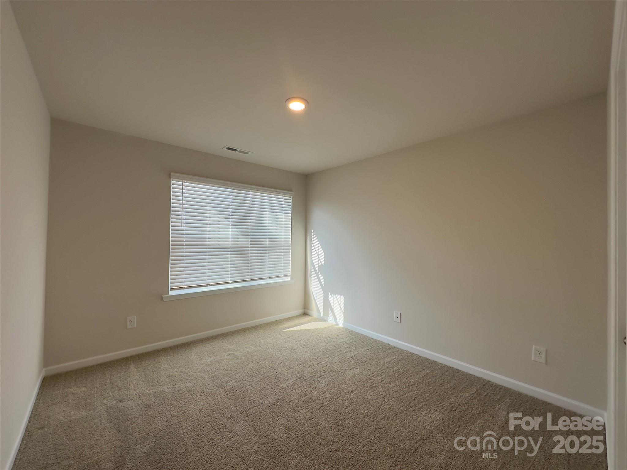 403 Wescott Street, Unit 68 Indian Trail, NC 28079 - Photo 23 of 42 a view of an empty room with a window
