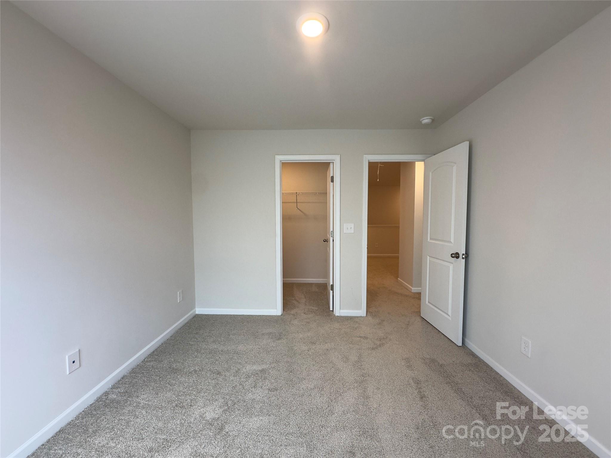 403 Wescott Street, Unit 68 Indian Trail, NC 28079 - Photo 24 of 42 an empty room with closet and a bathroom