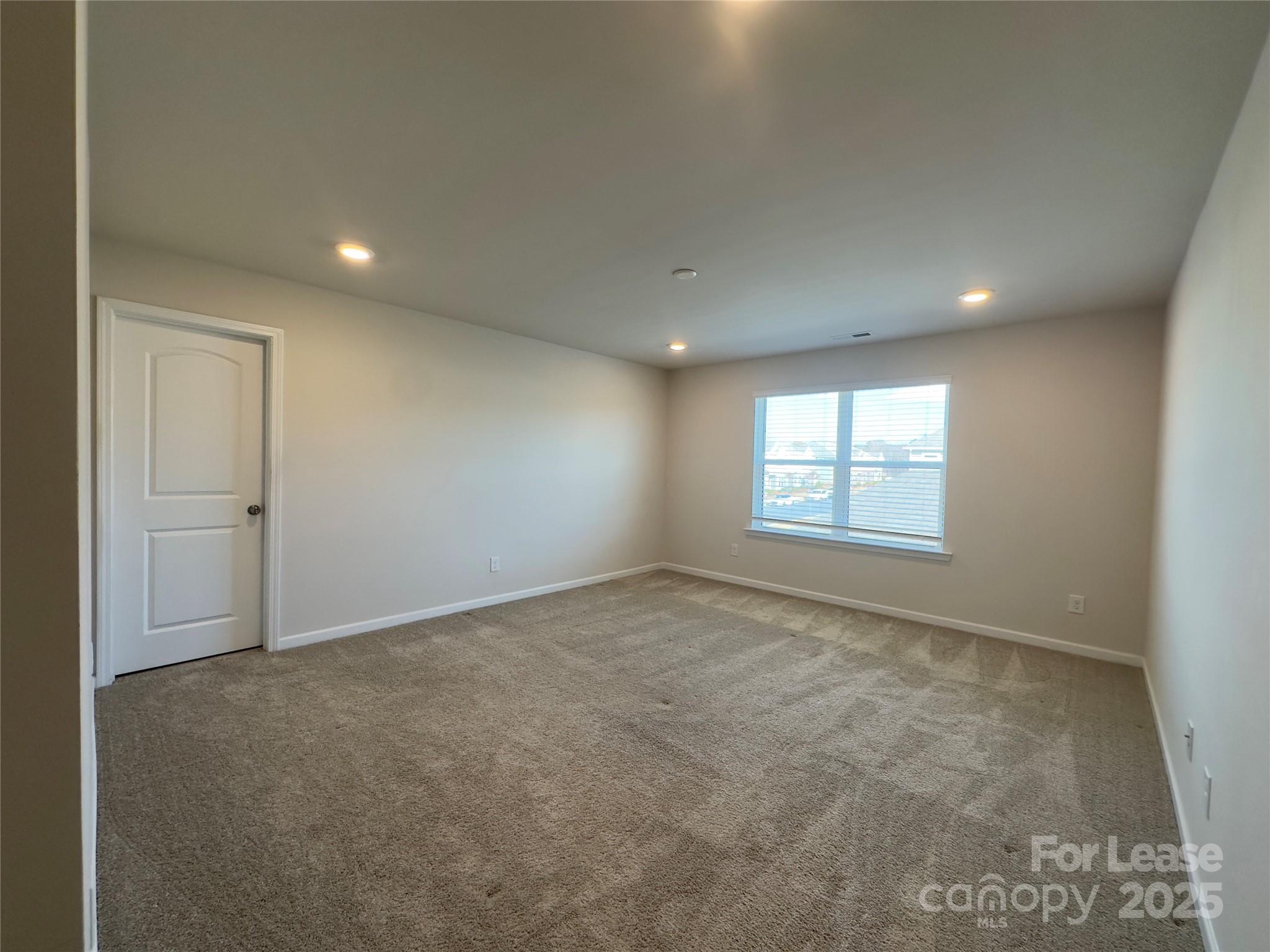 403 Wescott Street, Unit 68 Indian Trail, NC 28079 - Photo 26 of 42 an empty room with windows