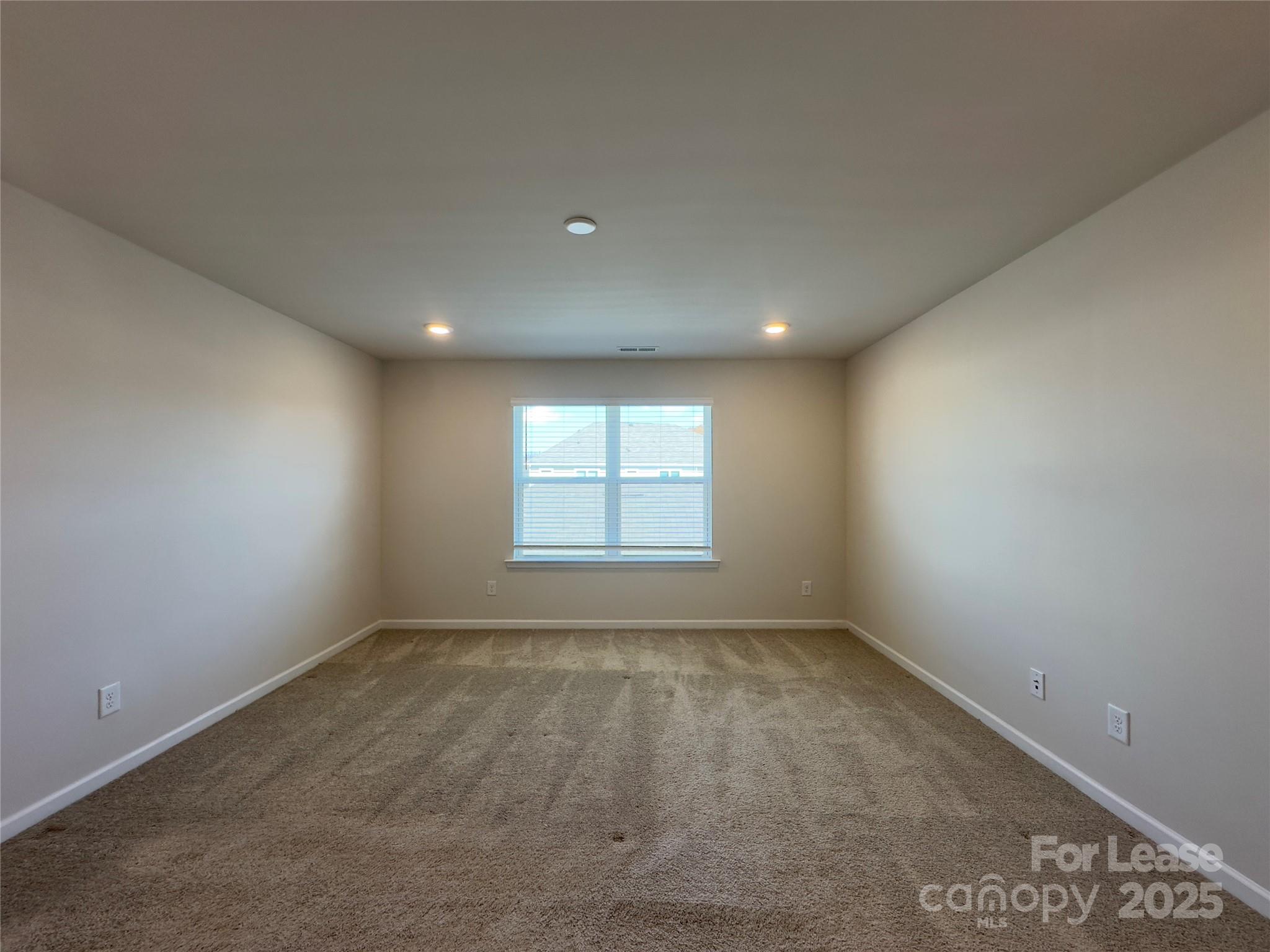 403 Wescott Street, Unit 68 Indian Trail, NC 28079 - Photo 27 of 42 an empty room with a empty space and windows