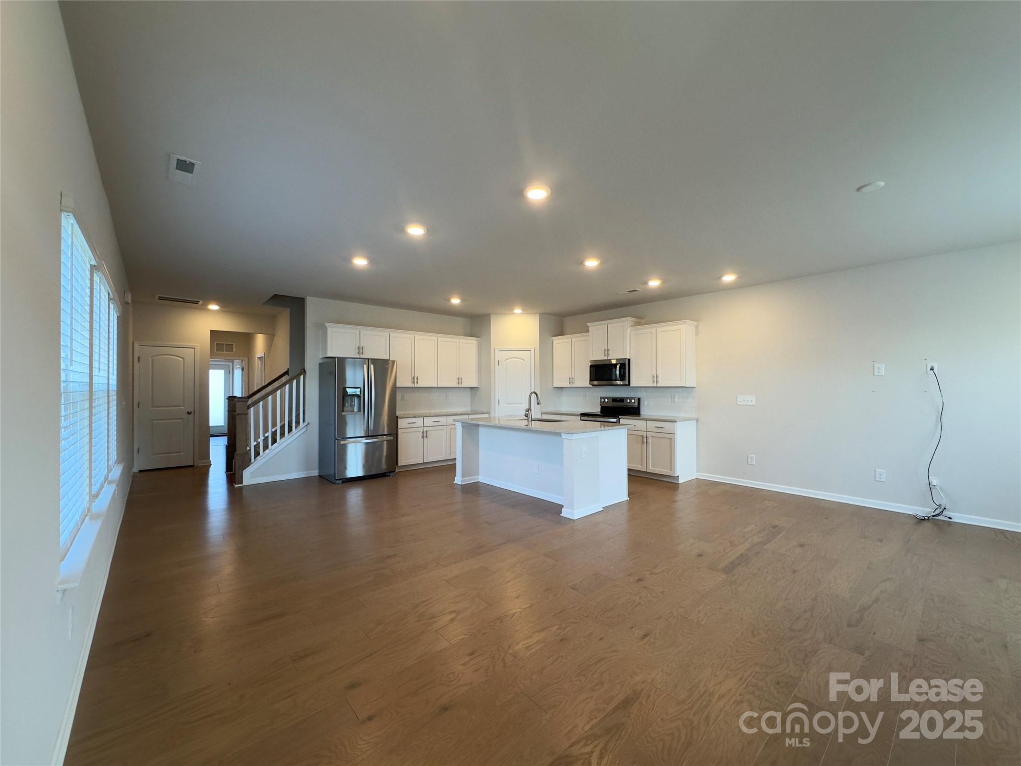 403 Wescott Street, Unit 68 Indian Trail, NC 28079 - Photo 3 of 42 a view of kitchen with kitchen island and stainless steel appliances