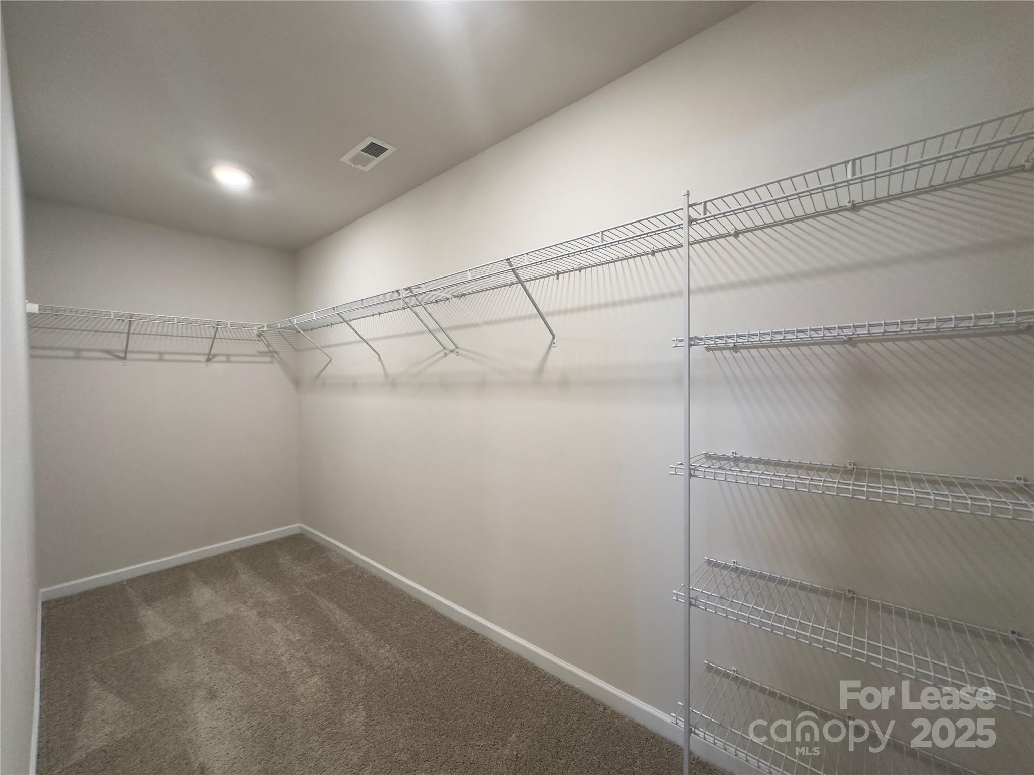 403 Wescott Street, Unit 68 Indian Trail, NC 28079 - Photo 31 of 42 a view of a room with racks on the wall