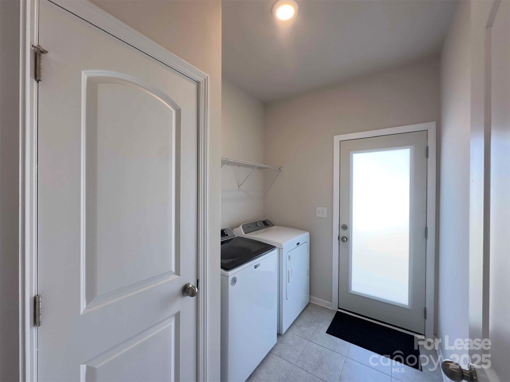 403 Wescott Street, Unit 68 Indian Trail, NC 28079 - Photo 34 of 42 a kitchen with a refrigerator and white cabinets