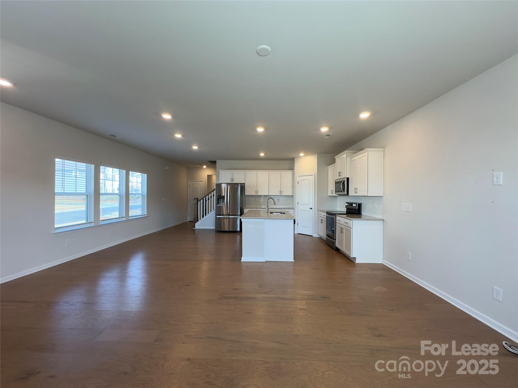 403 Wescott Street, Unit 68 Indian Trail, NC 28079 - Photo 4 of 42 a view of kitchen with kitchen island sink and center island