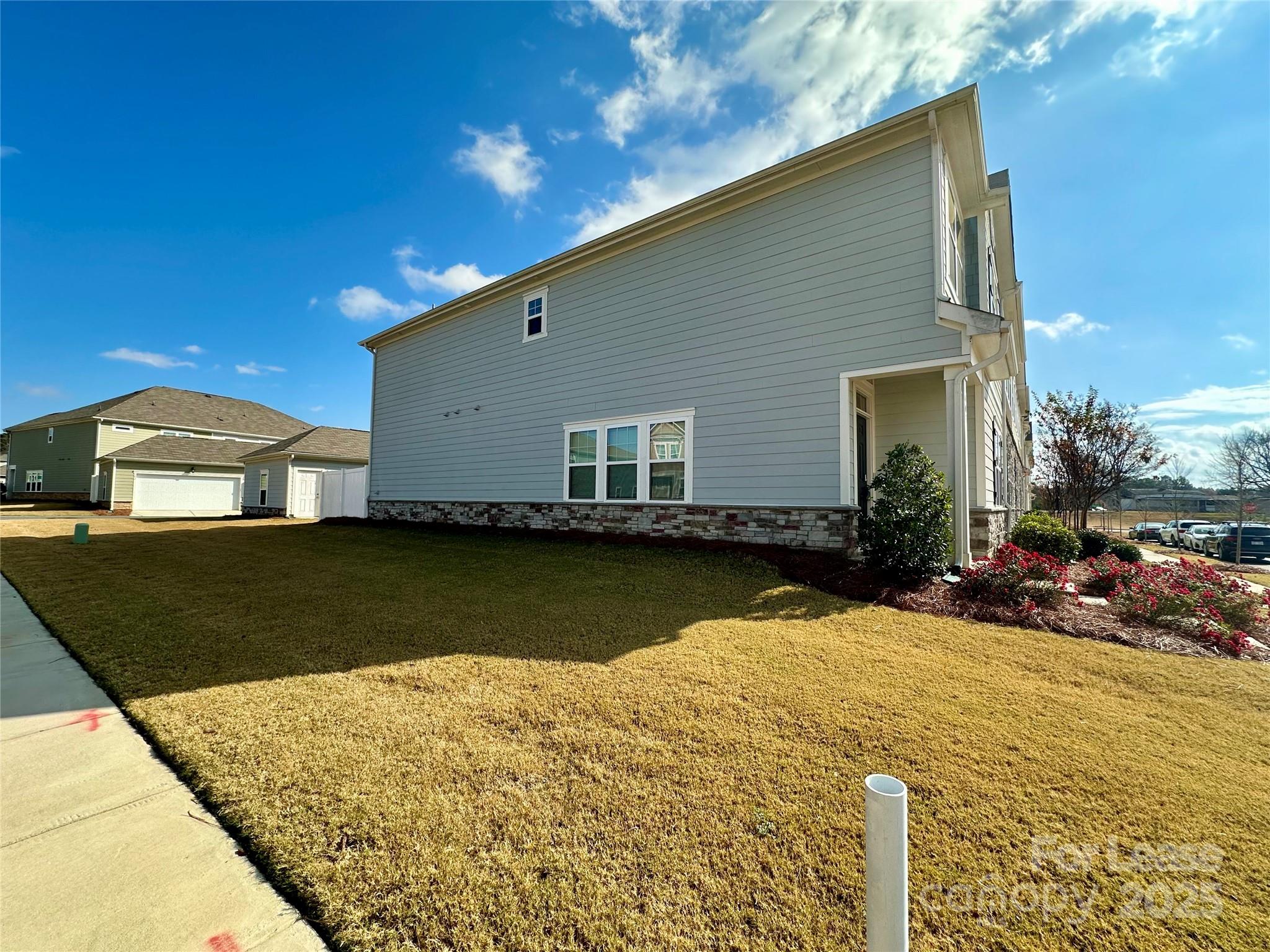 403 Wescott Street, Unit 68 Indian Trail, NC 28079 - Photo 41 of 42 a front view of a house with a yard