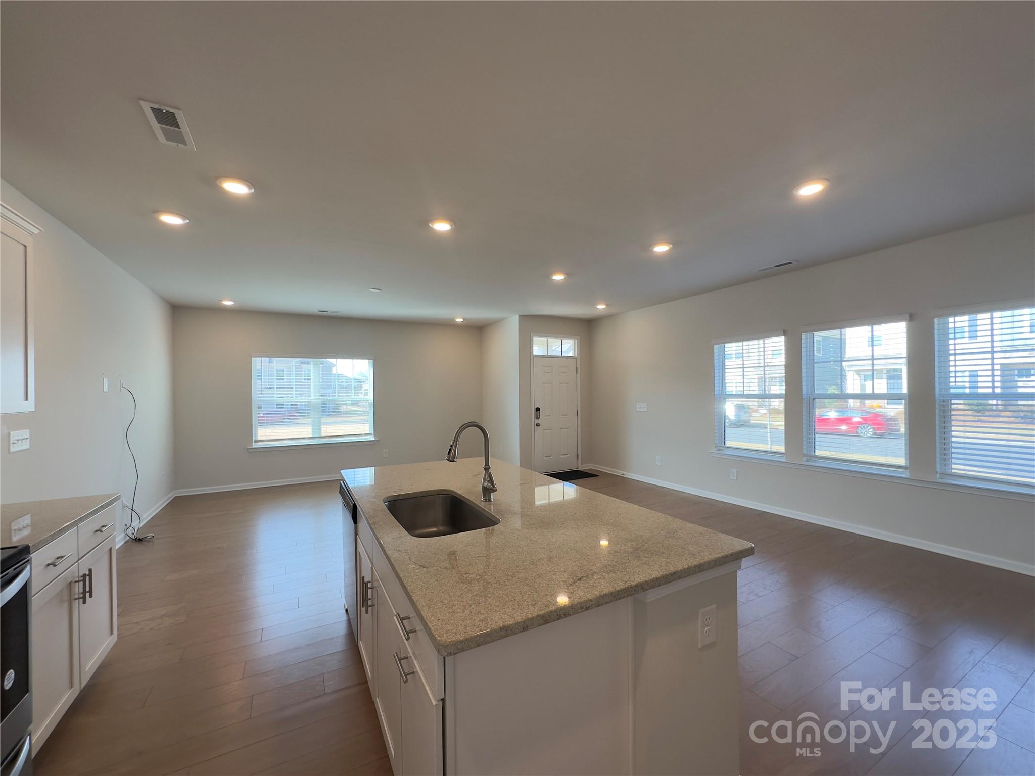 403 Wescott Street, Unit 68 Indian Trail, NC 28079 - Photo 7 of 42 a living room with stainless steel appliances furniture a kitchen view and a window
