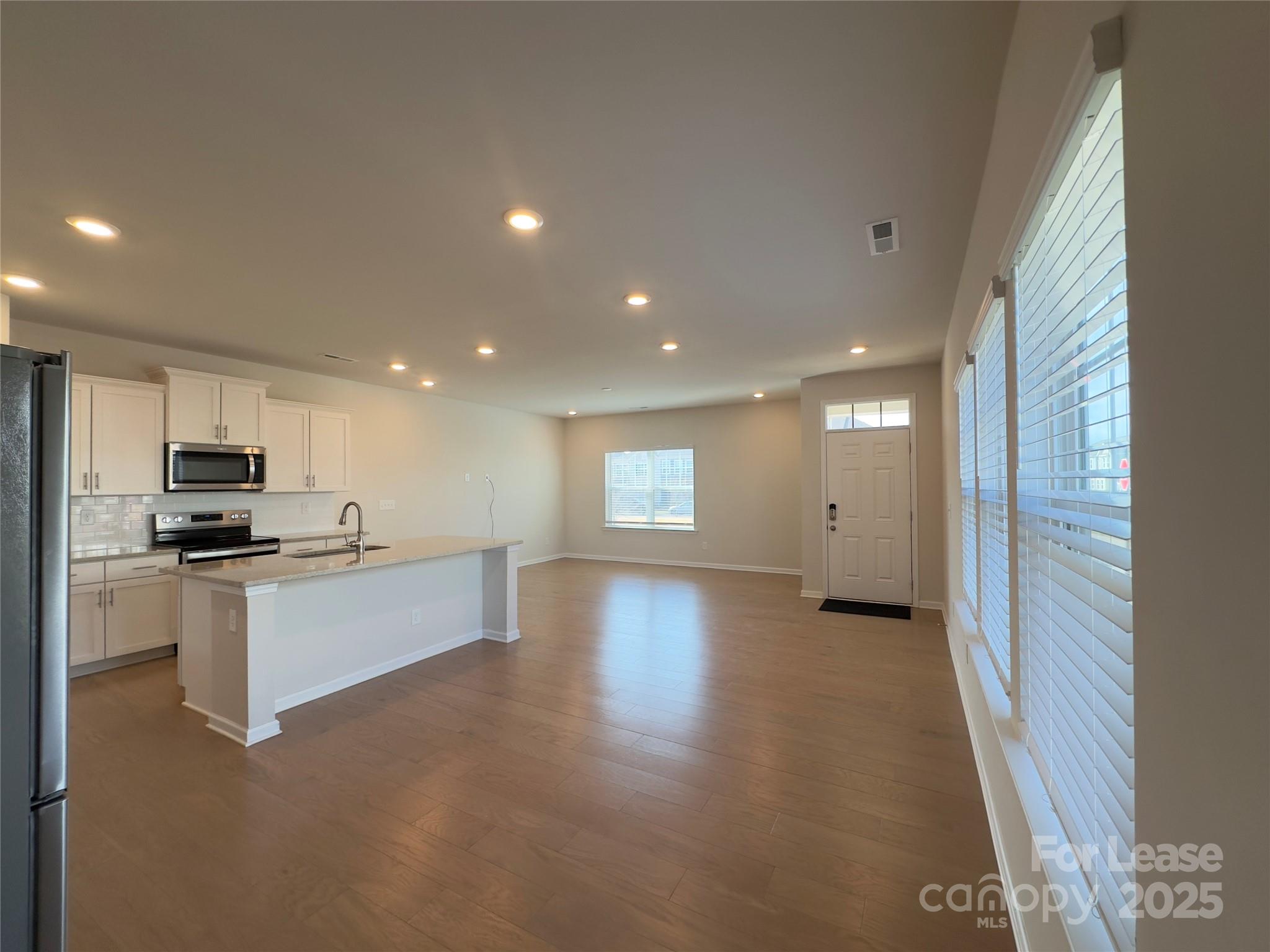 403 Wescott Street, Unit 68 Indian Trail, NC 28079 - Photo 10 of 42 a view of kitchen with microwave a stove and cabinets