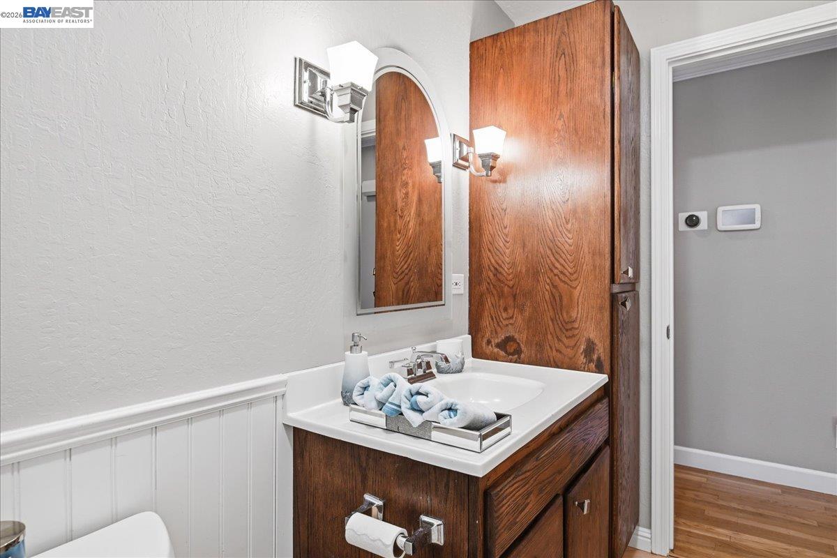 2861 Millbridge Place San Ramon, CA 94583 - Photo 40 of 58 a bathroom with a sink a toilet and mirror