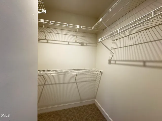 a view of a room with racks on the wall