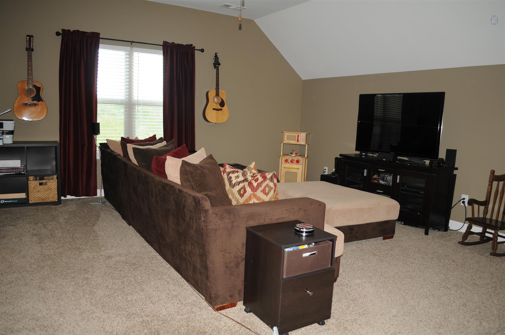 3946 C Hickory Ridge Road Lebanon, TN 37087 - Photo 13 of 16 a living room with furniture a flat screen tv and a window