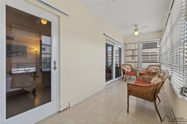 a view of a room with a table and chairs