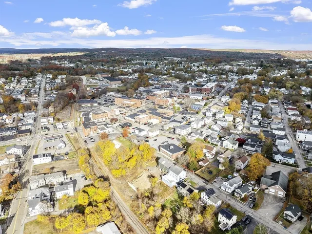 an aerial view of residential building with yard