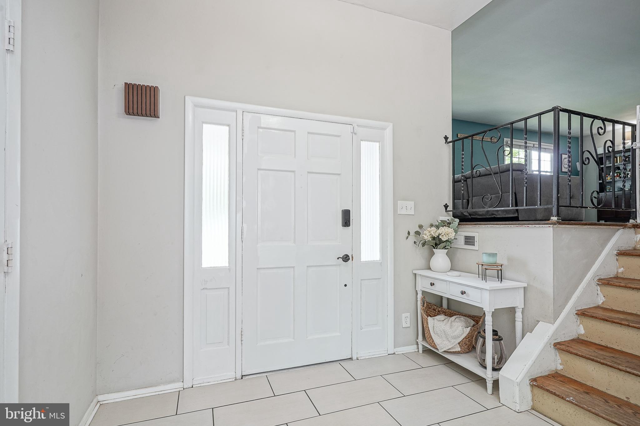 47 Bryant Road Blackwood, NJ 08012 - Photo 2 of 21 a view of a hallway with entryway wooden floor and front door