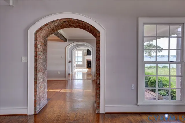 a view of entryway with wooden floor