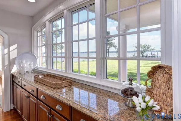 a kitchen that has a sink and a large window