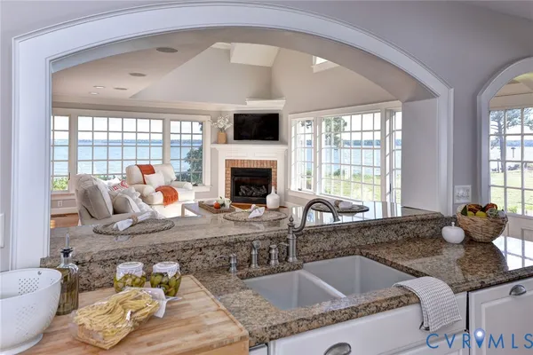 a living room with fireplace furniture and a fireplace