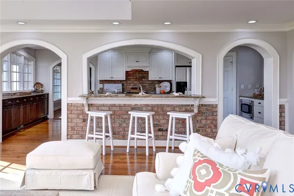 a living room with furniture fireplace and a table