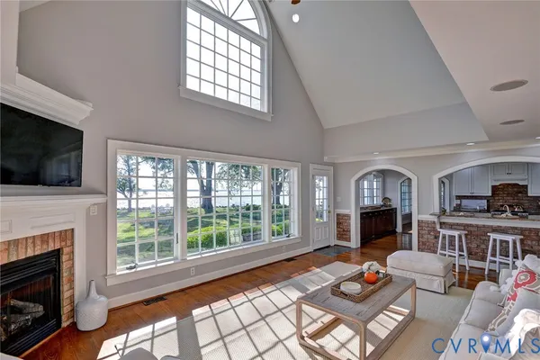 a living room with furniture fireplace and flat screen tv