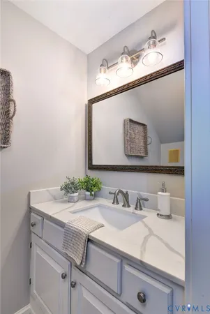 a view of a hallway with stairs and wooden floor