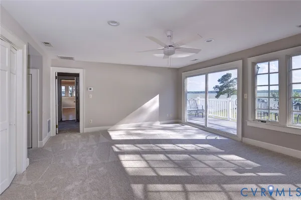 a view of balcony with wooden floor and fence