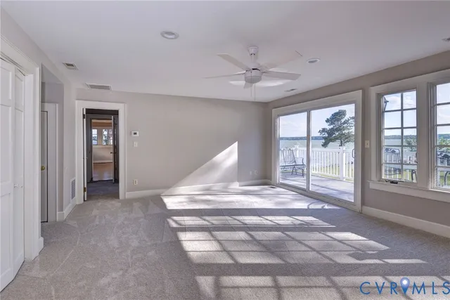 a view of balcony with wooden floor and fence