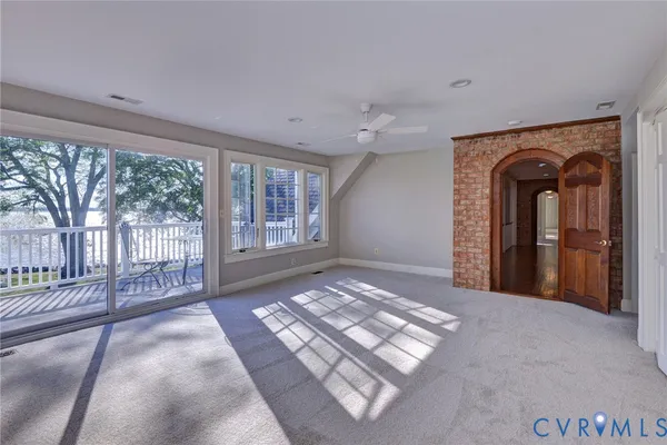 a bathroom with a granite countertop sink a toilet and bathtub