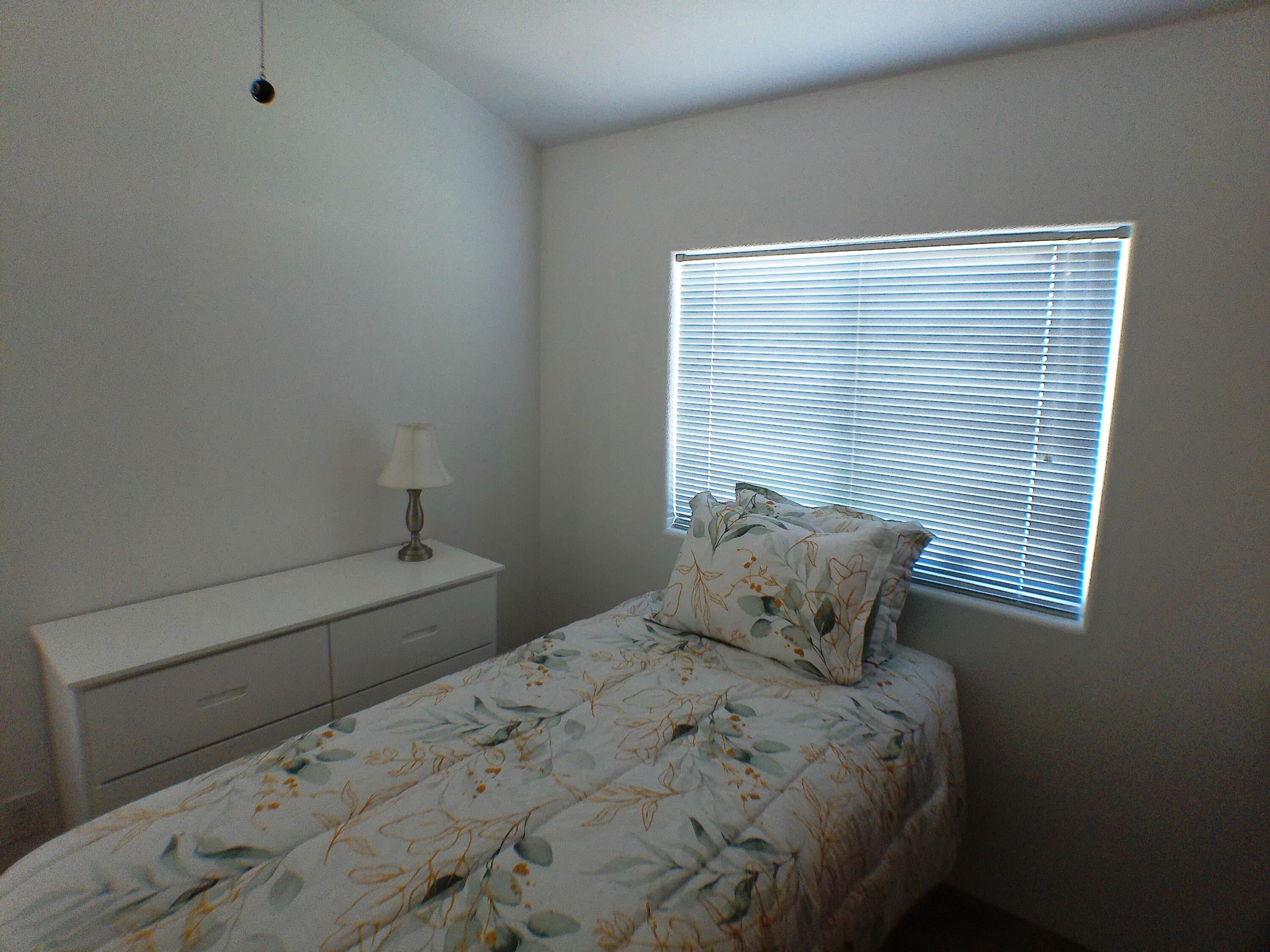 84136 Ave 44, Unit 477 Indio, CA 92203 - Photo 16 of 24 a bedroom with a bed and window