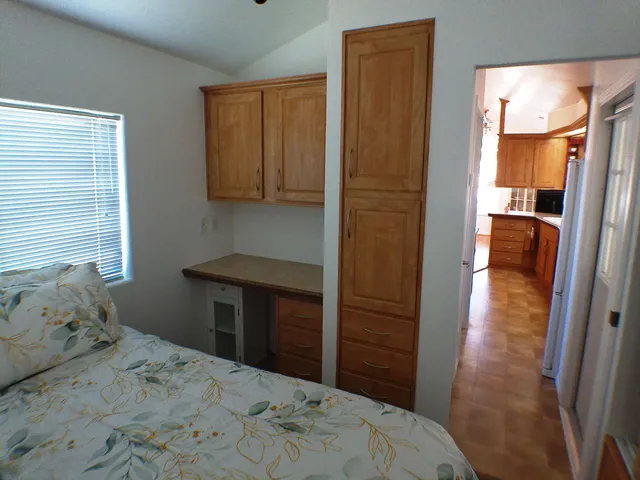 a bedroom with a bed and a dresser