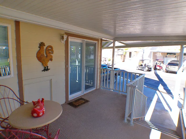 a view of porch with wooden floor