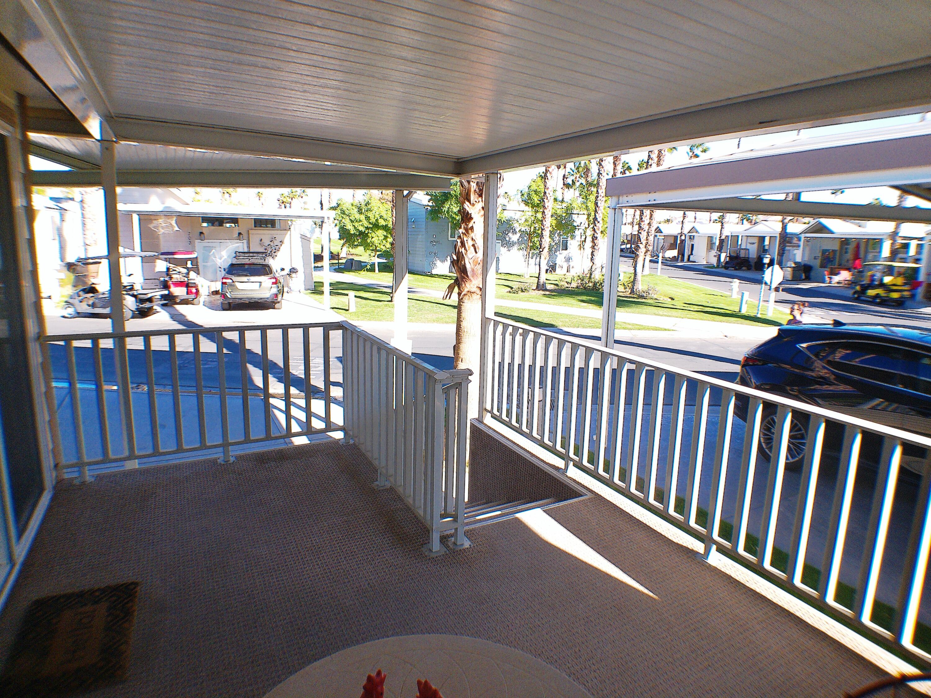 84136 Ave 44, Unit 477 Indio, CA 92203 - Photo 24 of 24 a view of porch with wooden floor