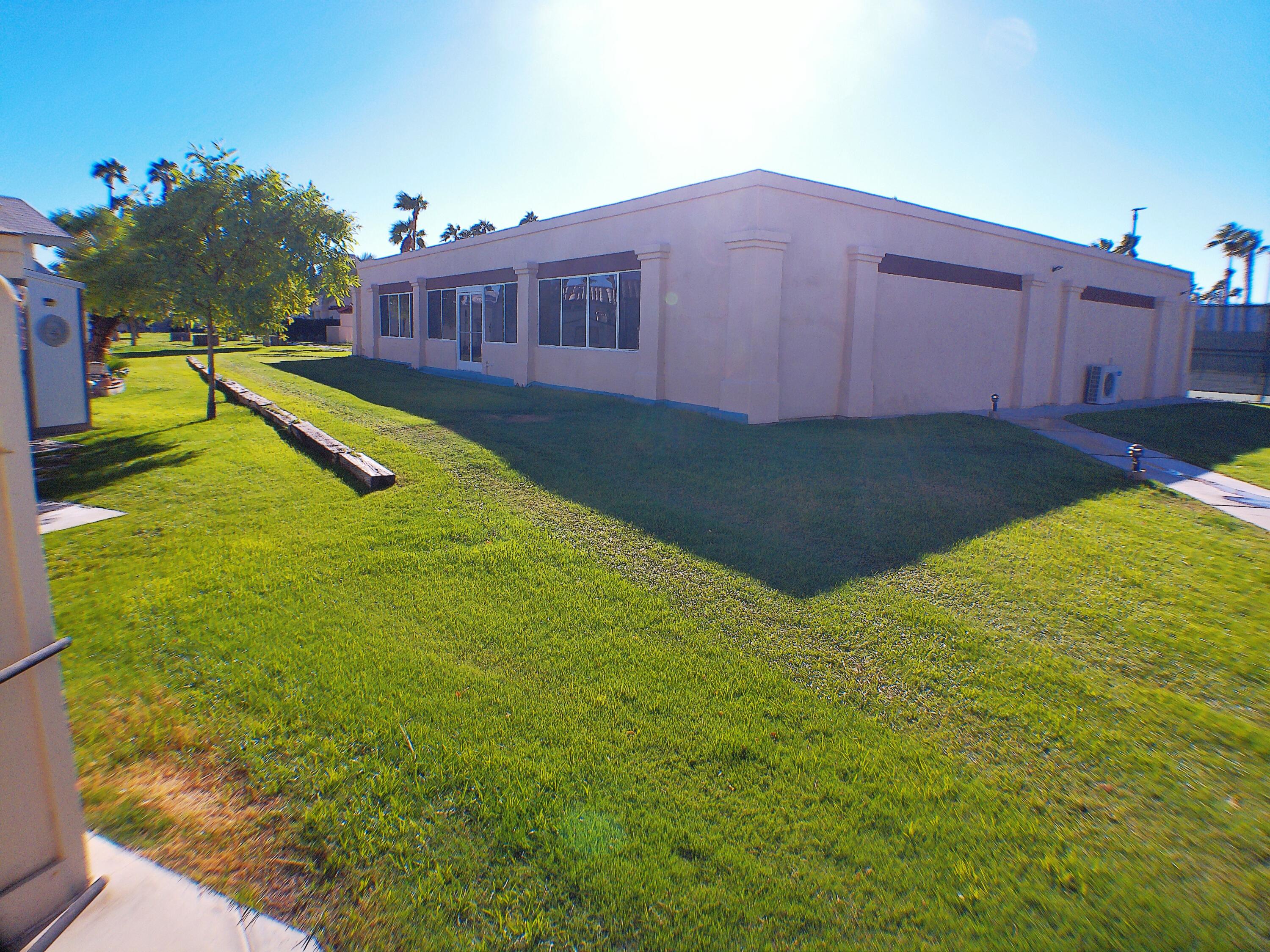 84136 Ave 44, Unit 477 Indio, CA 92203 - Photo 5 of 24 a view of a backyard with plants and small yard