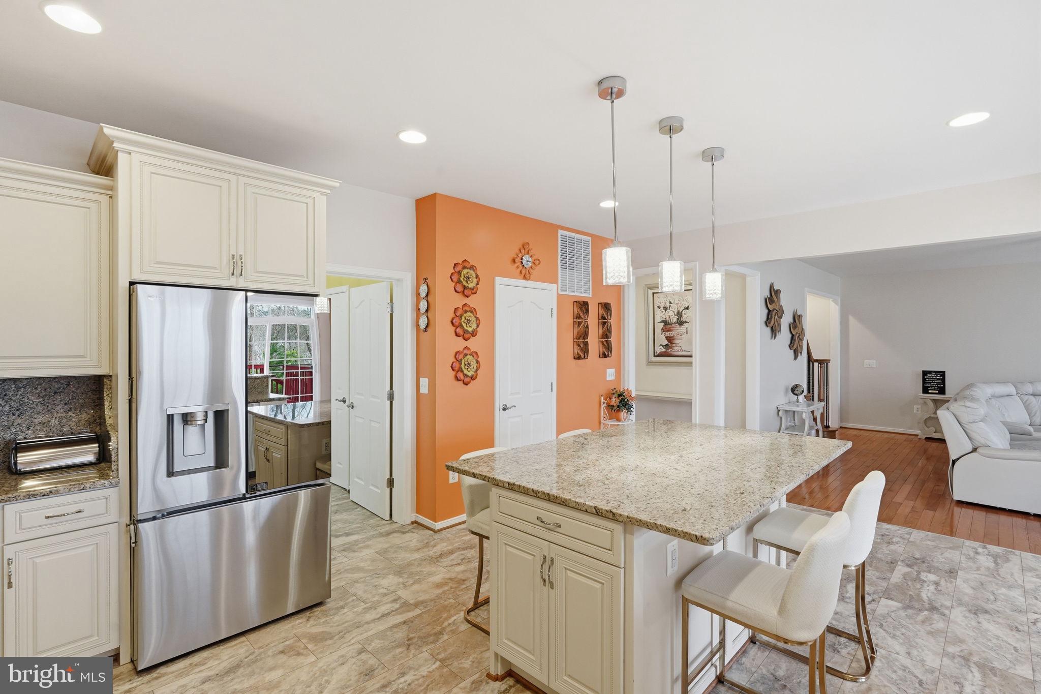 14 Smelters Trace Road Stafford, VA 22554 - Photo 15 of 78 a kitchen with stainless steel appliances granite countertop a refrigerator a oven and white cabinets