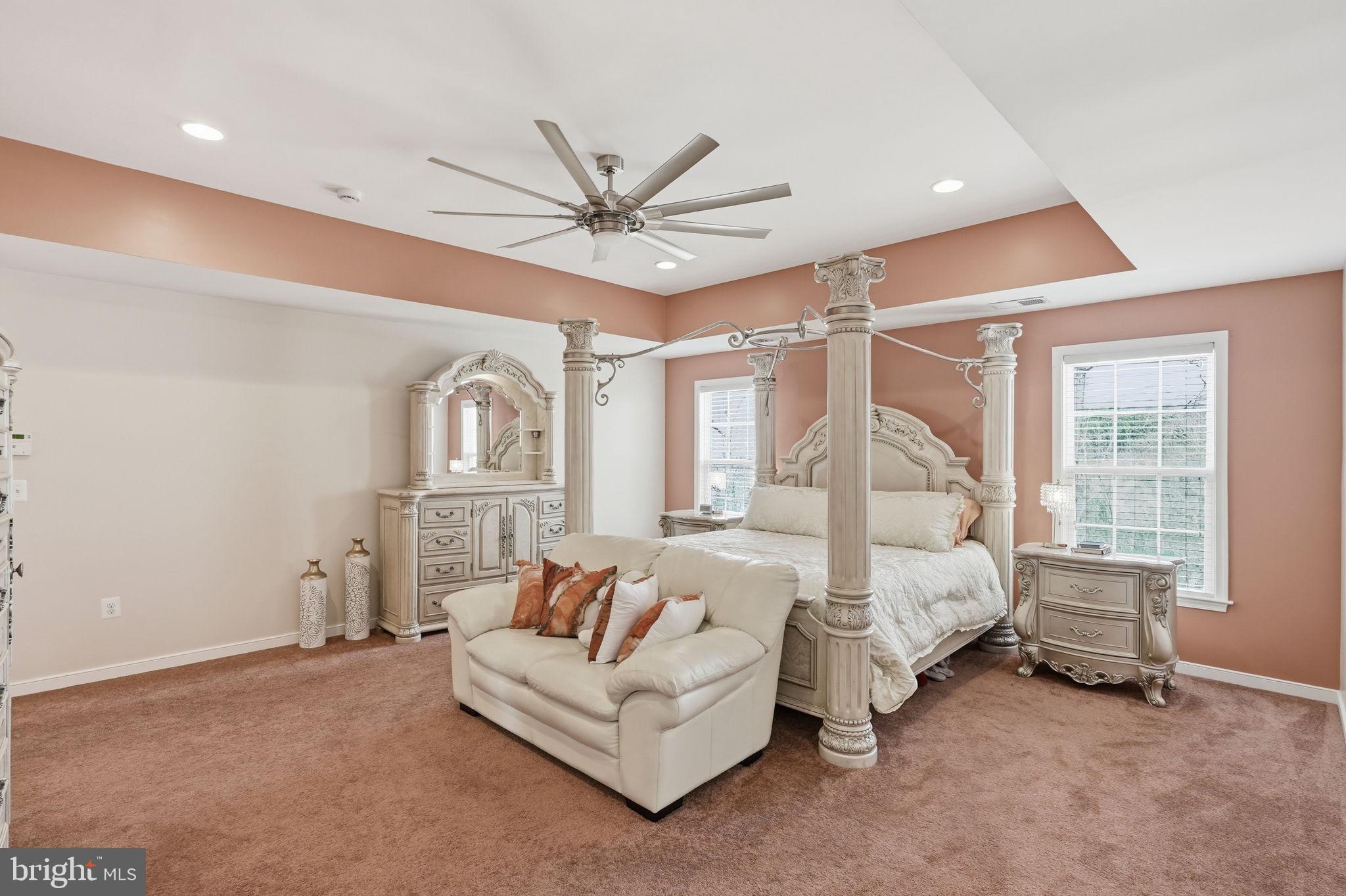 14 Smelters Trace Road Stafford, VA 22554 - Photo 34 of 78 a spacious bedroom with a bed a couch and large window