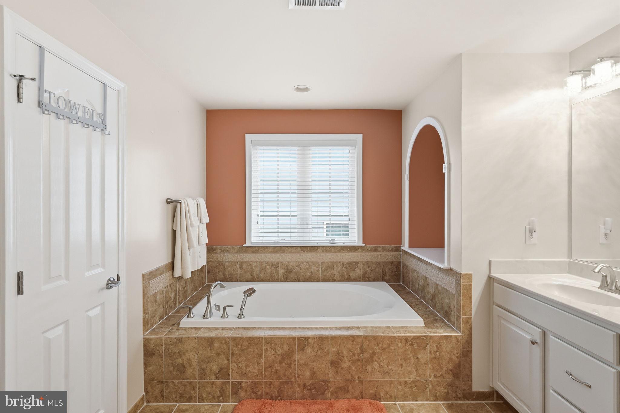 14 Smelters Trace Road Stafford, VA 22554 - Photo 40 of 78 a bathroom with a tub a sink and a window