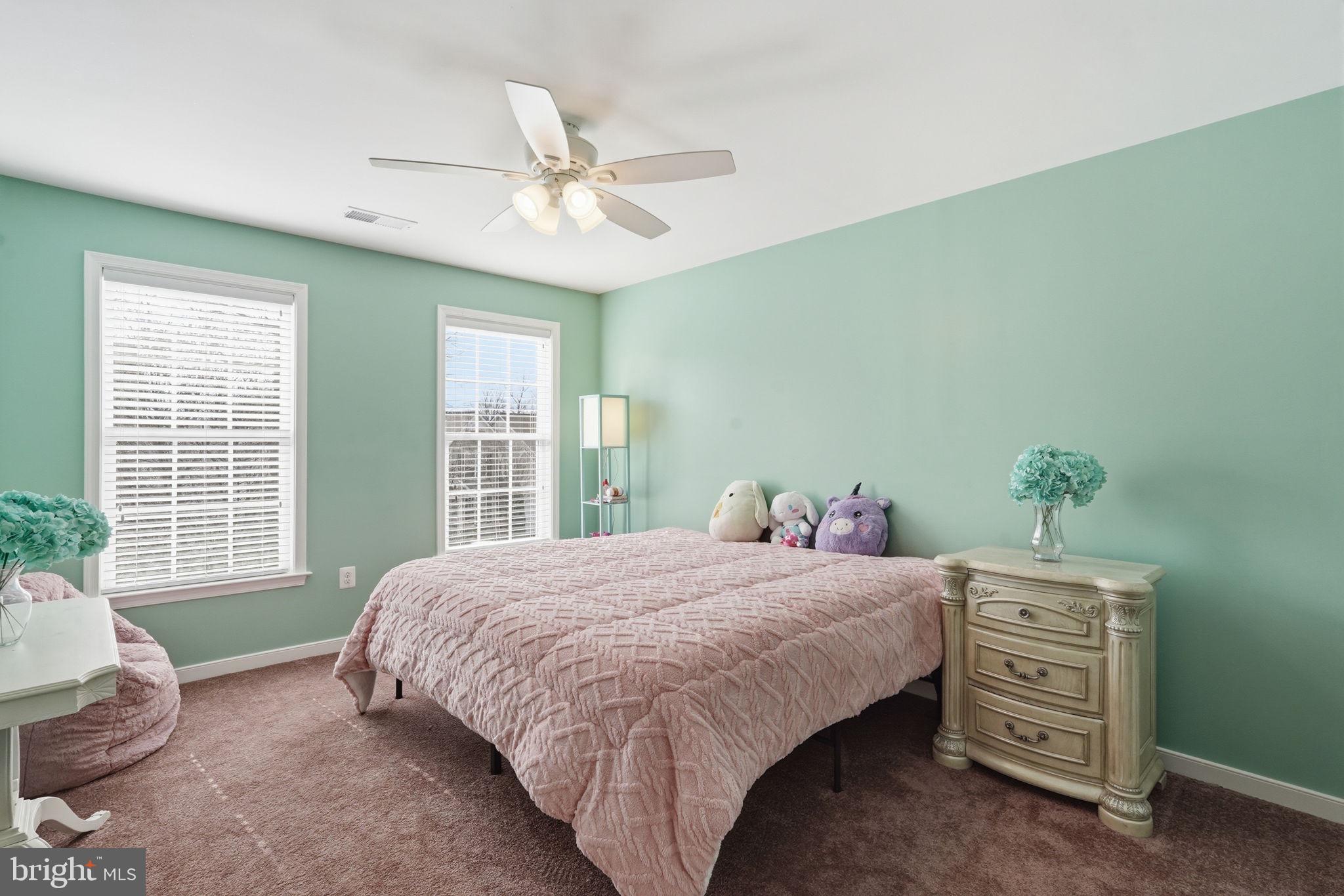 14 Smelters Trace Road Stafford, VA 22554 - Photo 45 of 78 a bedroom with a bed a chandelier and a window