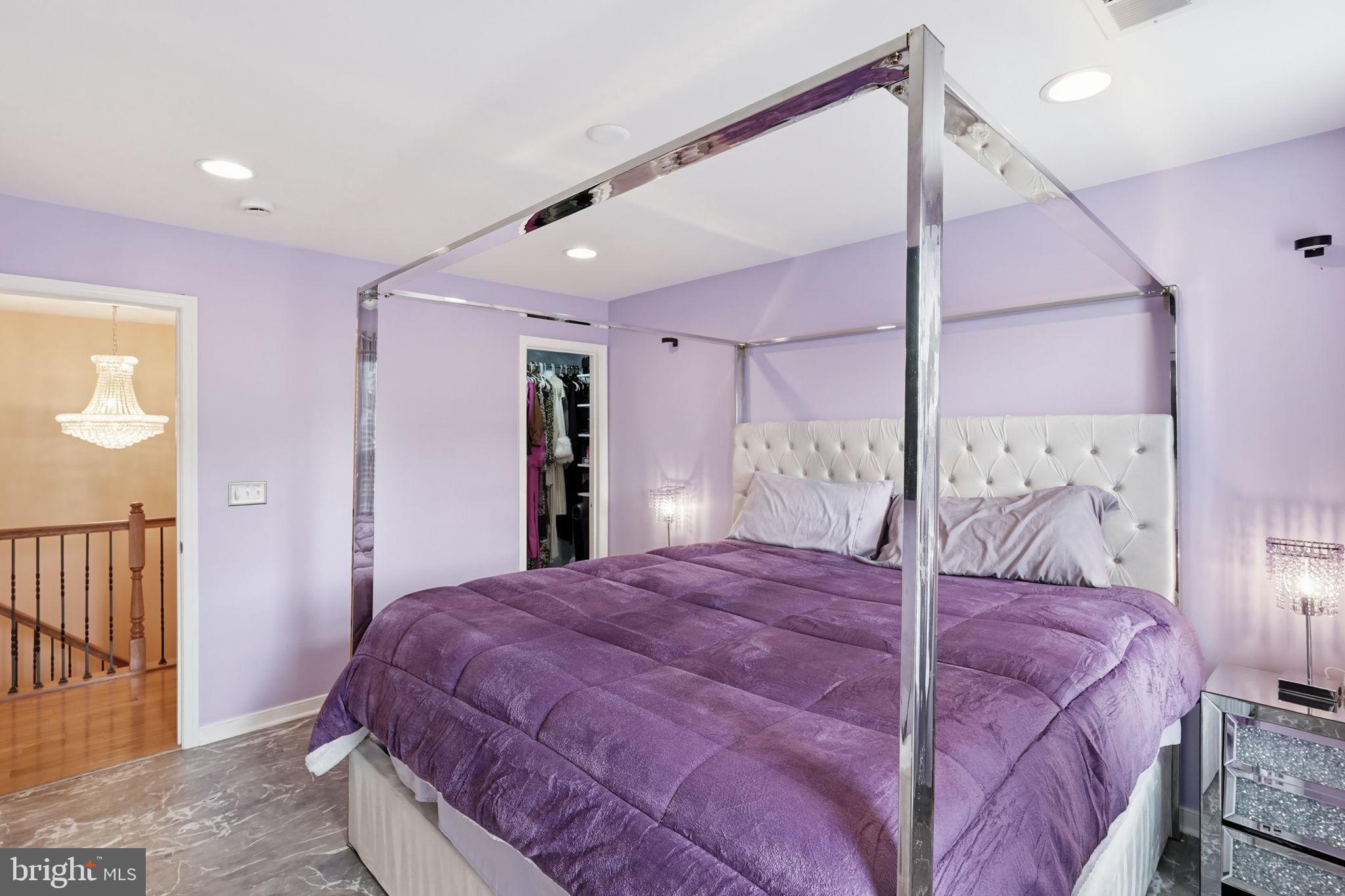 14 Smelters Trace Road Stafford, VA 22554 - Photo 51 of 78 a bedroom with a large bed and a chandelier