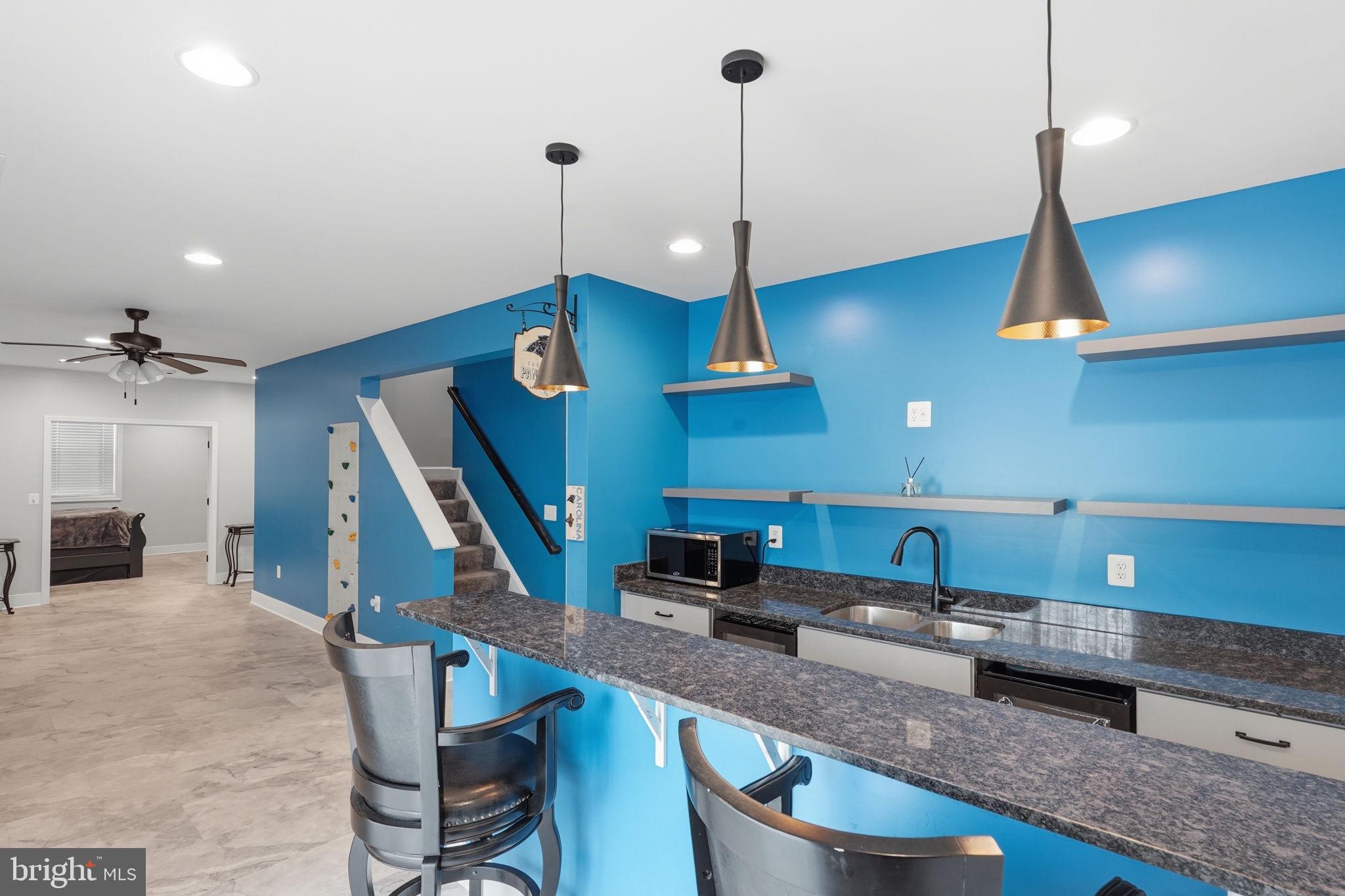 14 Smelters Trace Road Stafford, VA 22554 - Photo 55 of 78 a kitchen with stainless steel appliances granite countertop a sink a stove and a wooden floors
