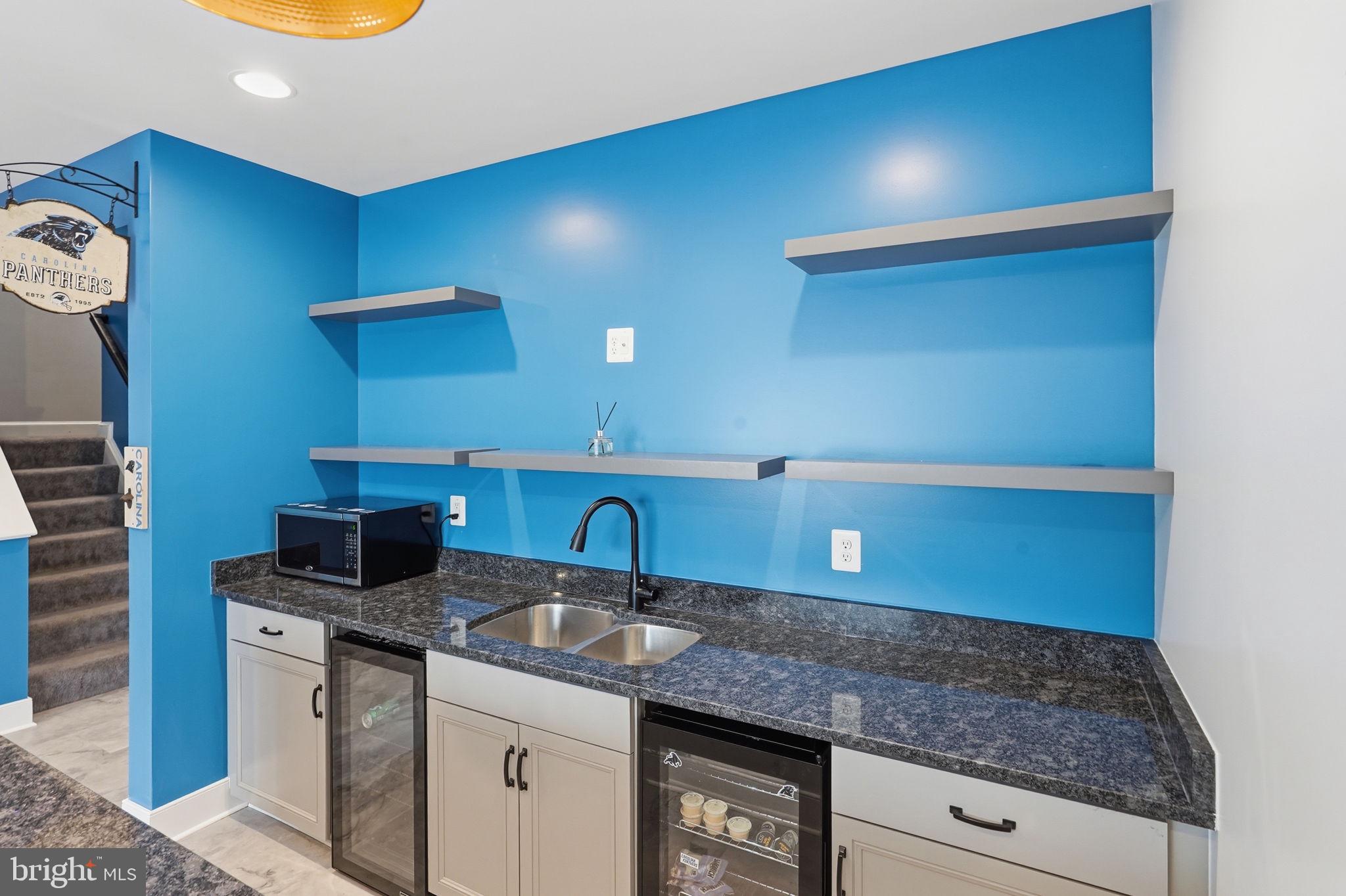 14 Smelters Trace Road Stafford, VA 22554 - Photo 57 of 78 a kitchen with a sink and a mirror