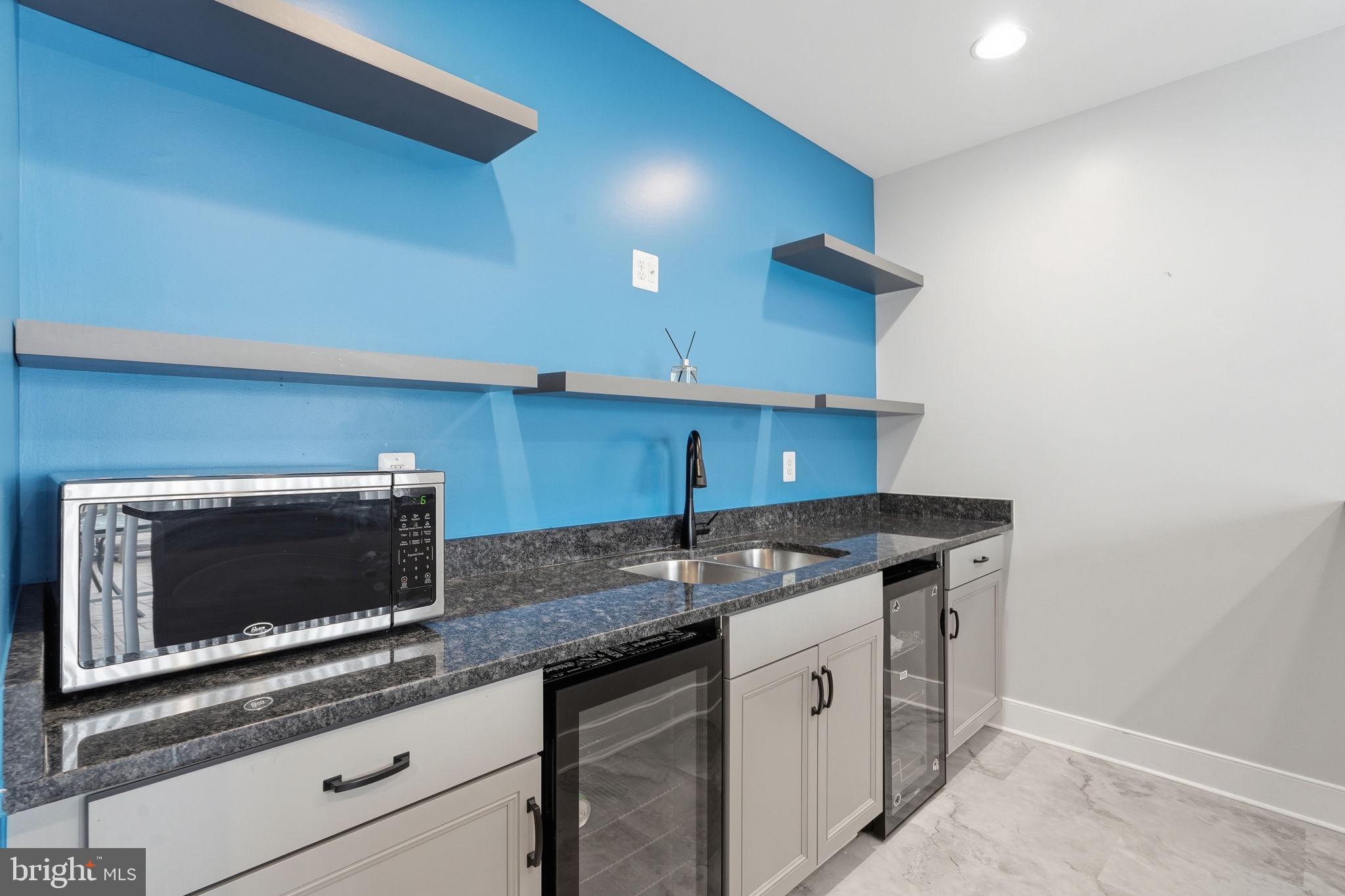 14 Smelters Trace Road Stafford, VA 22554 - Photo 58 of 78 a kitchen with stainless steel appliances granite countertop a sink and a microwave