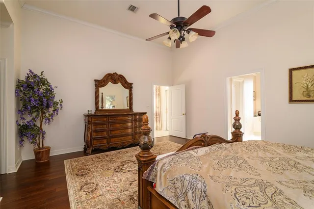 a bed room with a bed and a chandelier