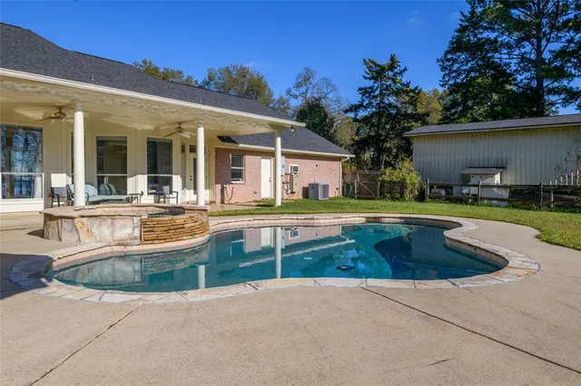 a view of outdoor space with swimming pool and porch