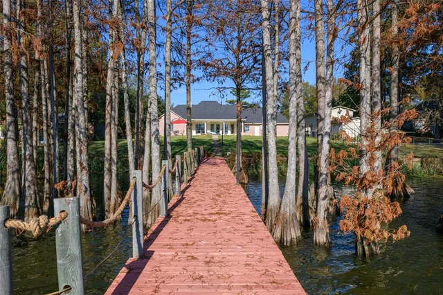 a view of a pathway with a wrought fence