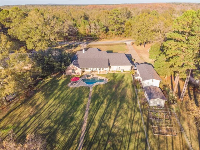 an aerial view of residential houses with outdoor space