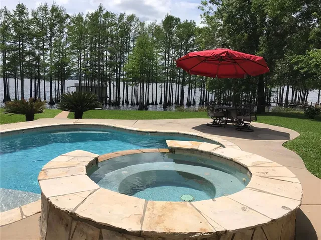 a view of a swimming pool with a patio