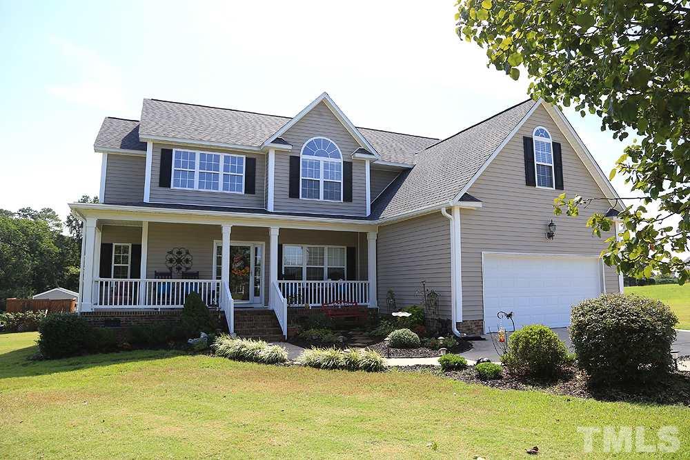 214 Steve Ridge Willow Spring, NC 27592 - Photo 1 of 29 a front view of a house with a yard