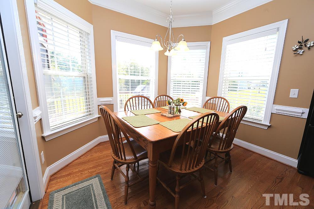 214 Steve Ridge Willow Spring, NC 27592 - Photo 13 of 29 a view of a dining room with furniture window and wooden floor