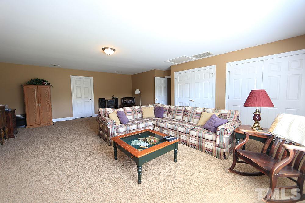 214 Steve Ridge Willow Spring, NC 27592 - Photo 23 of 29 a living room with furniture and a table